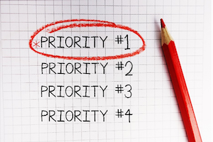 Priority Word Written in Notebook
