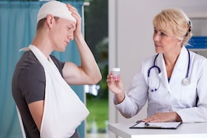 Injured boy speaking to doctor