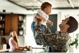 Soldier Carrying a Child